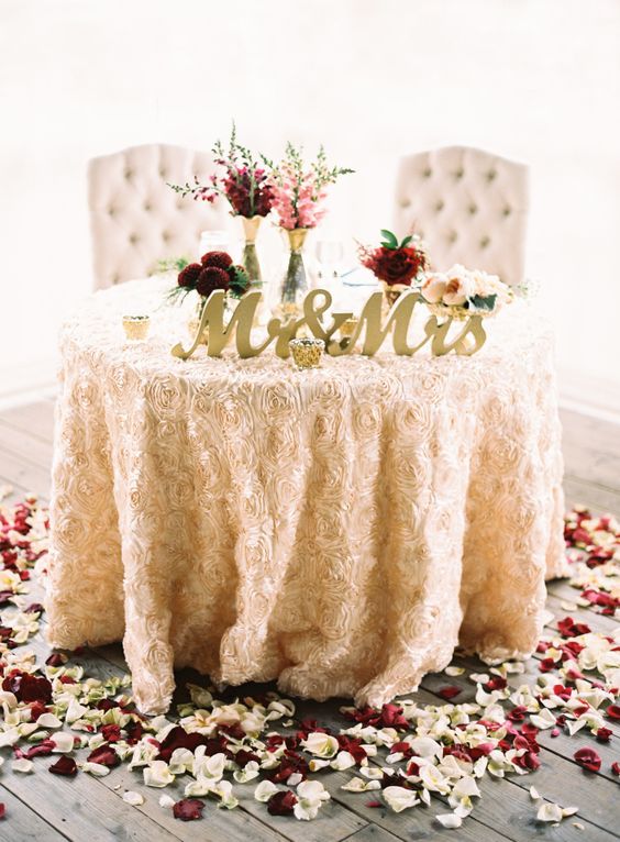 Petal accented sweetheart table