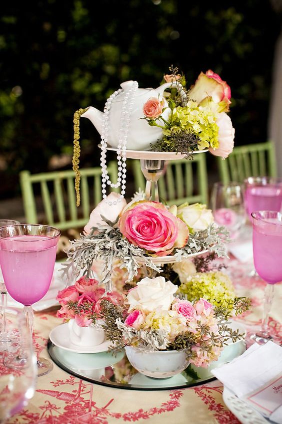 bridal shower centerpiece with roses, tea cups, and tea pots on vintage tiered stand