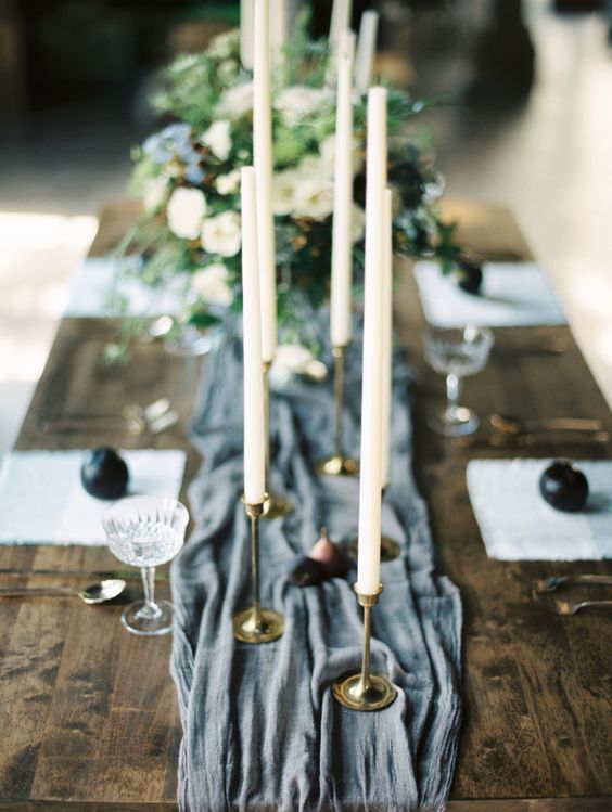 candlesticks and dusty blue wedding table runner
