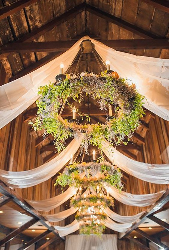hung greenery chandeliers for barn wedding