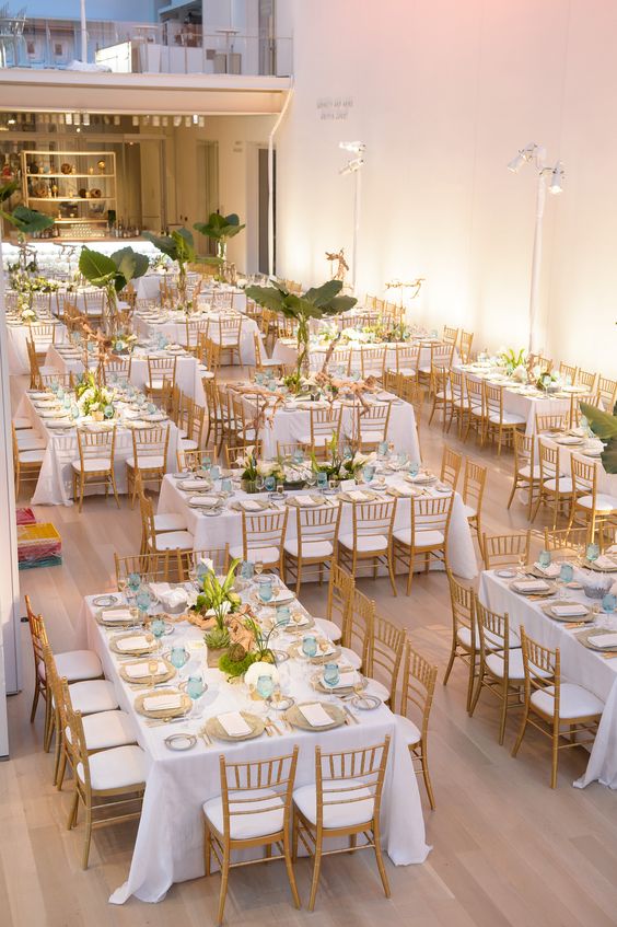 indoor gold and mint wedding table layout