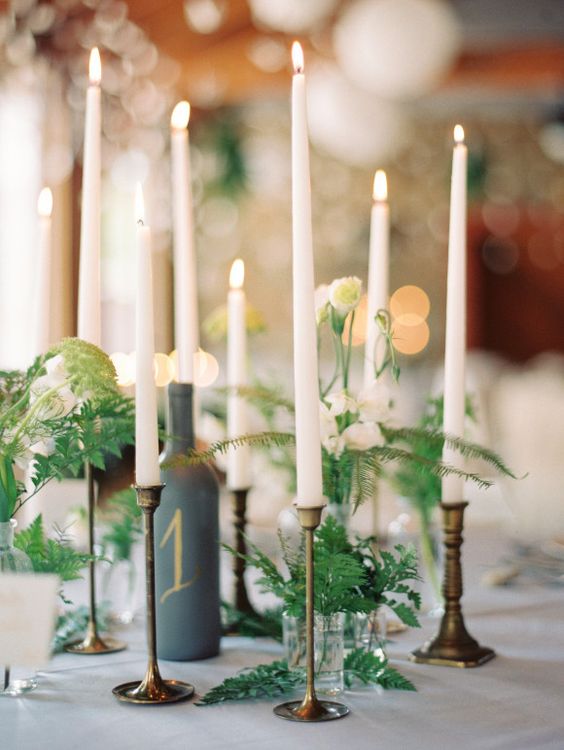 taper candles and ferns wedding centerpiece