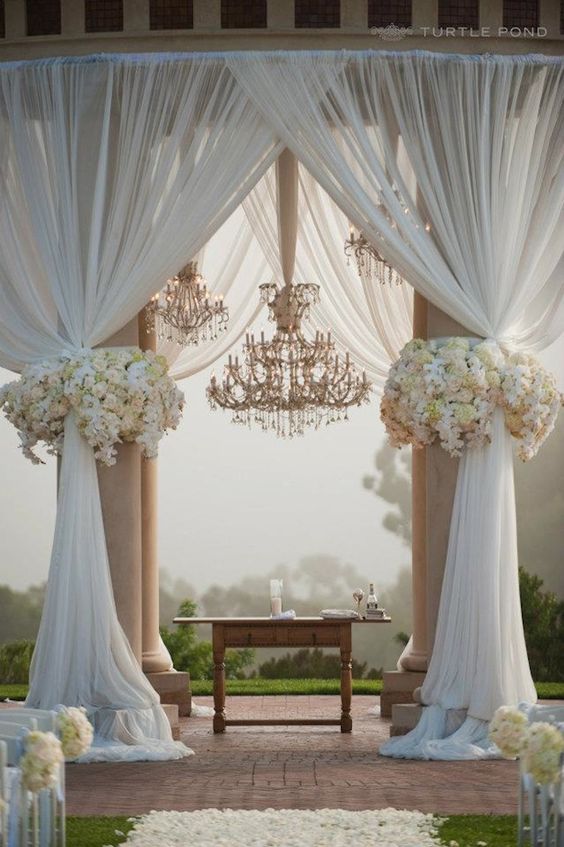 wedding ceremony backdrop with chandelier