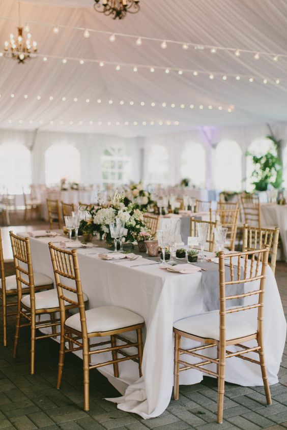 Cozy tented reception with pretty string lights