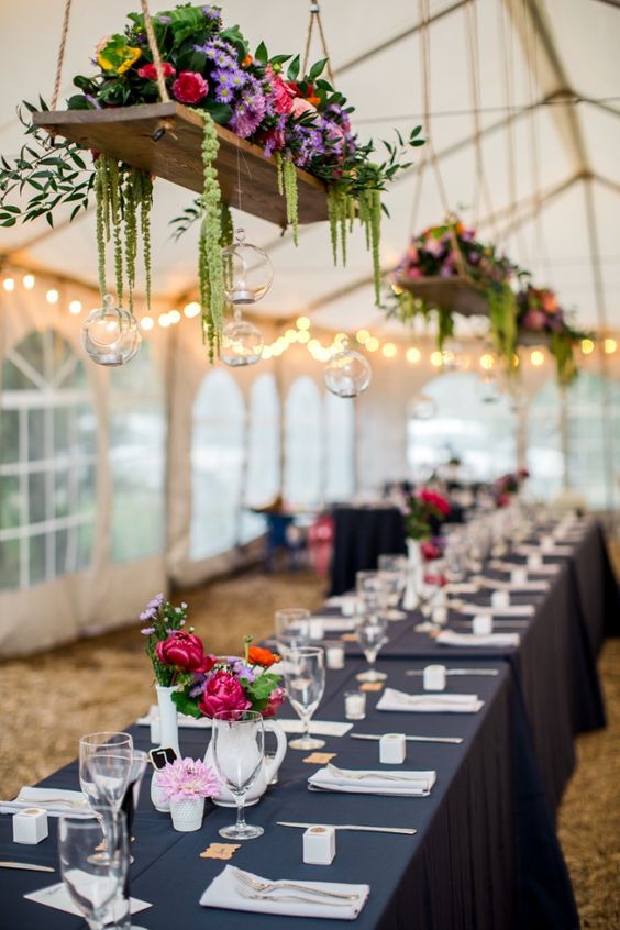 Tent wedding decor with Hanging centerpiece.