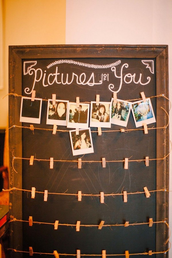 Polaroid camera at the sign in table for guests to take photos to display on this cool board
