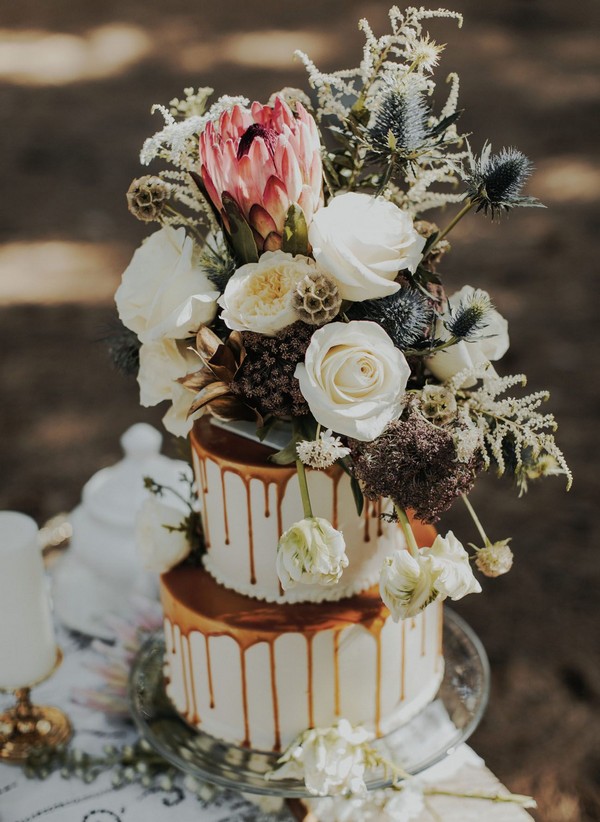 chocolate drip wedding cake with autumnal florals
