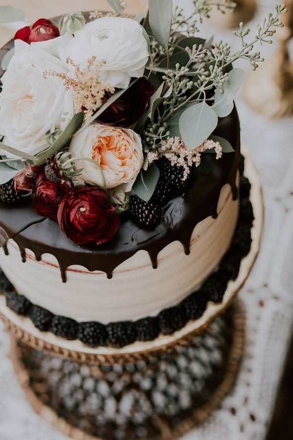 chocolate drip wedding cake with autumnal florals