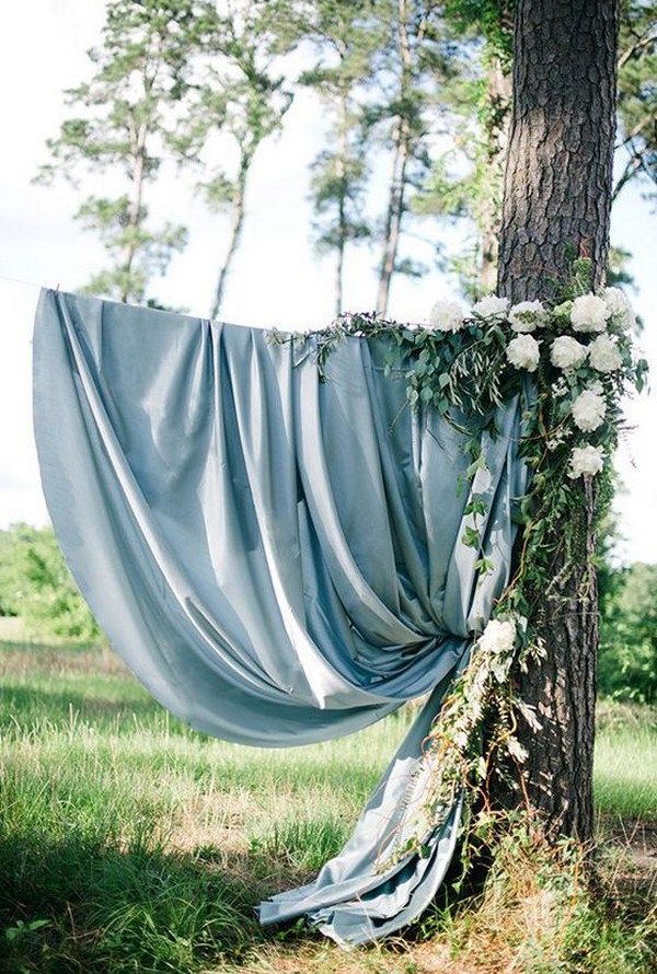 Dusty blue and greenery wedding backdrop