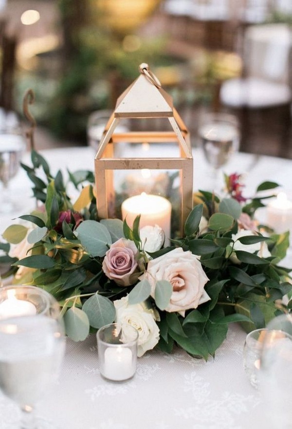 Gold Lantern centerpiece with ring of flowers and greenery