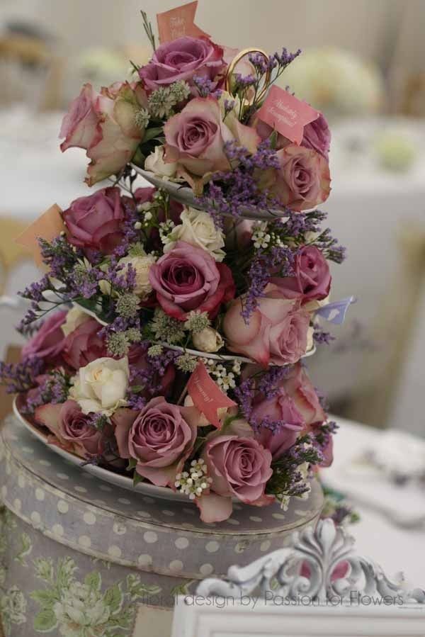 Vintage cake stand with pastel coloured roses