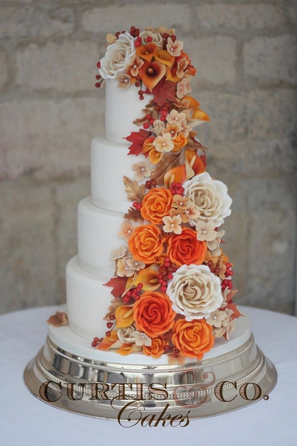 fall themed wedding cake with warm reds, oranges and creams