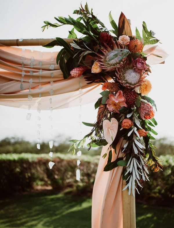 moody blush pink and shades of orange fall wedding arch ideas
