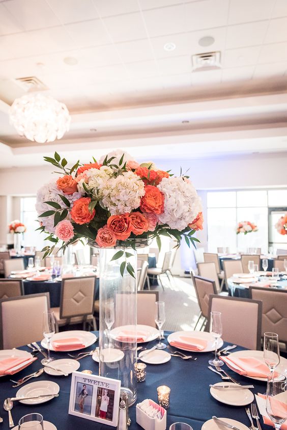 tall coral and navy wedding centerpiece