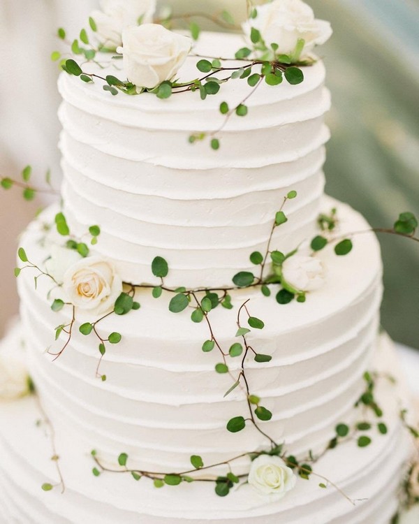 white buttercream wedding cake with white roses 14