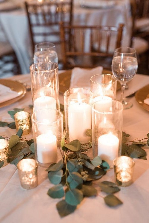 eucalyptus and candles wedding centerpiece