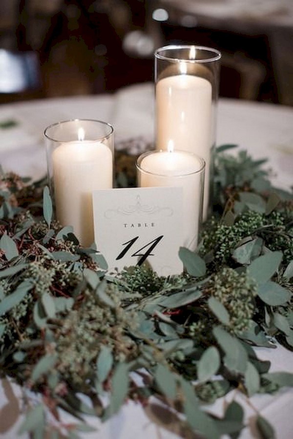 greenery wreath with white candles + elegant table number