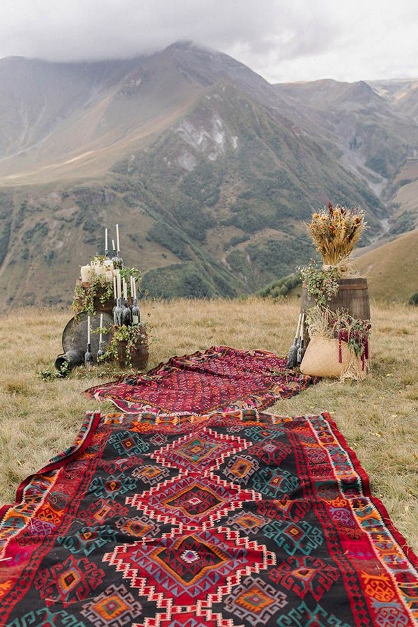 bohemian fall wedding backdrop with blanket runner