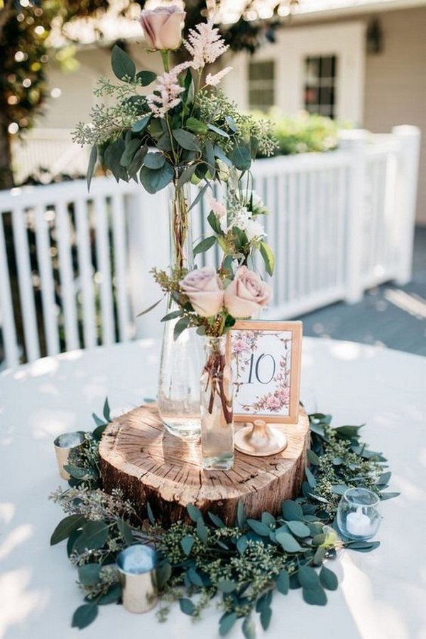 dusty rose wedding centerpiece with tree stumps