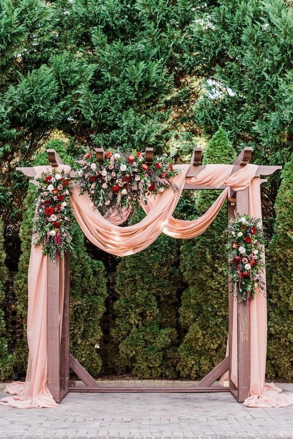 dusty rose wedding centerpiece with tree stumps