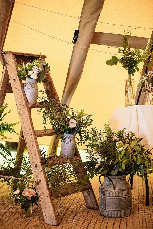 Rustic wedding decor ladder photos flowers
