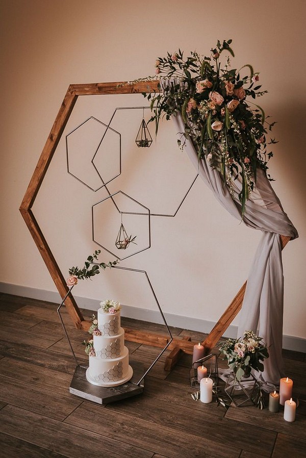 indoor hexagon wedding arch with neutral flower