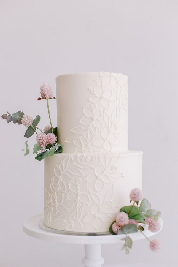 elegant white wedding cake with pink flowers