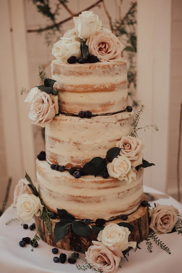 rustic naked wedding cake with pink roses