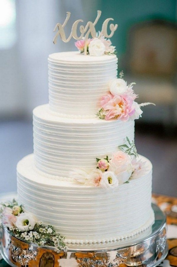 spectacular buttercream wedding cake with pink flowers