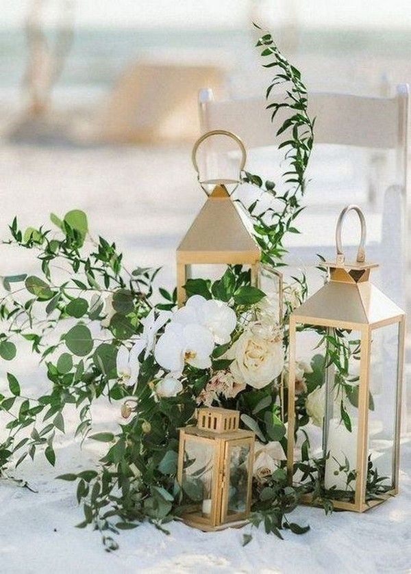 beach wedding aisle decoration ideas with gold lanterns and greenery15