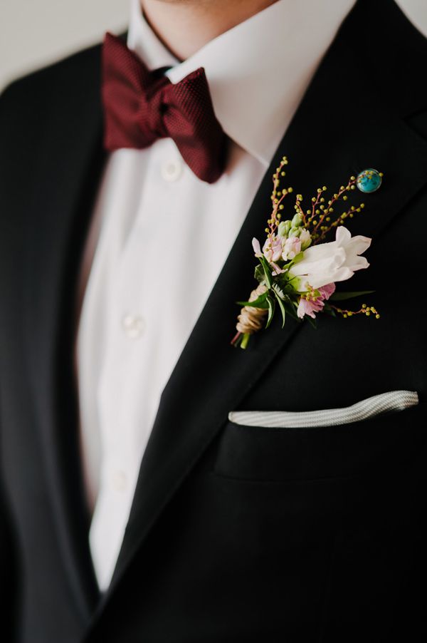 black fall and winter groom wedding suit and burgundy tie