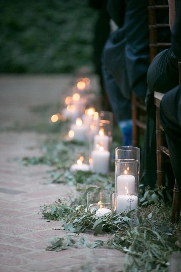 outdoor wedding ceremony aisle with branches and candles1