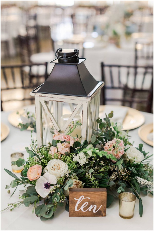 rustic wooden lantern and greenery wedding centerpiece
