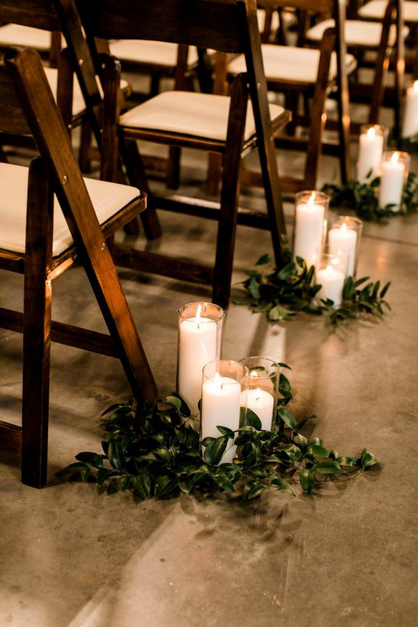 simple elegant wedding aisle ideas with candles and greenery
