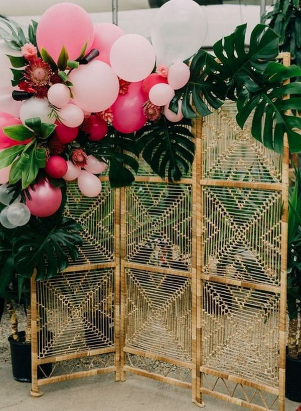 tropical wedding backdrop-ideas with greenery and balloons