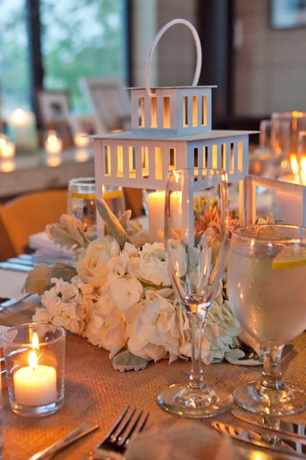 white roses and lantern wedding centerpiece
