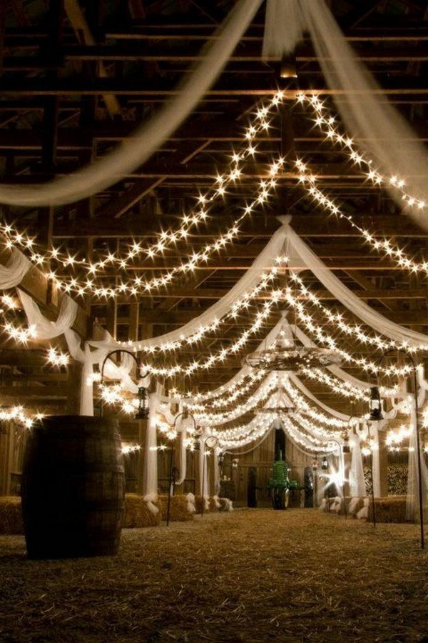 barn wedding reception ideas with draping fabric and lighting