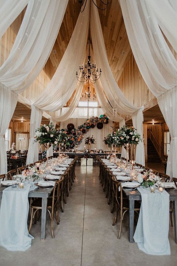 fabric draped barn wedding reception with string lights