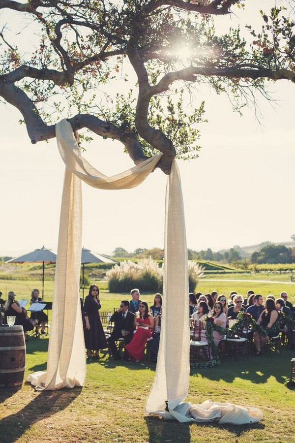 drapery on a tree wedding arch ideas