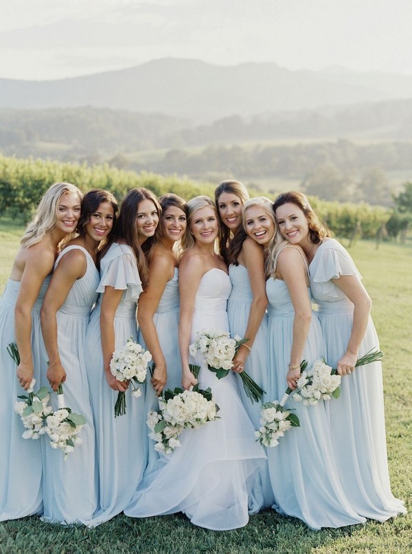 light blue mismatched bridesmaid dresses and green wedding bouquet