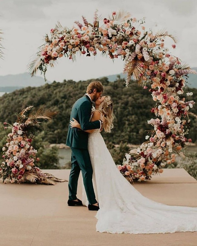 Bride And Groom Under Arch Wedding Photos #wedding #photos #weddingphotos #arches #weddingarches