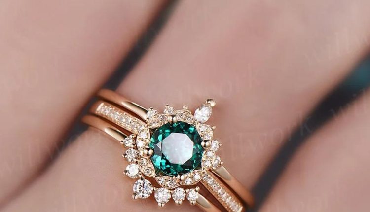 halo emerald engagement ring set